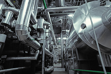 Image showing Equipment, cables and piping as found inside of a modern industr