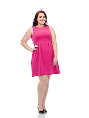 Image showing happy young plus size woman posing in pink dress