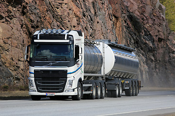 Image showing White Volvo FH Tank Truck on Highway with Rock Background