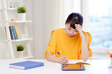 Image showing tired asian woman student with tablet pc at home