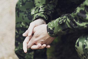 Image showing close up of young soldier in military uniform