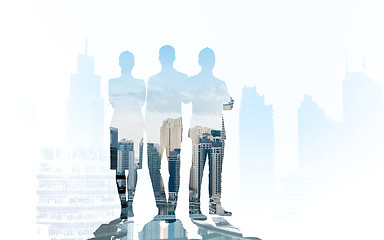 Image showing business people silhouettes over city background