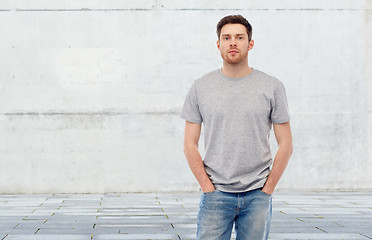 Image showing young man in gray t-shirt and jeans