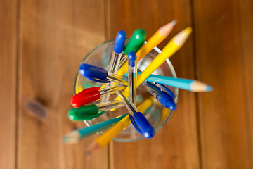 Image showing close up of stand or glass with pens and pencils