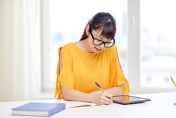 Image showing asian woman student with tablet pc at home