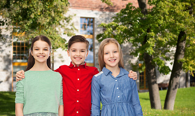 Image showing happy children hugging over summer campus