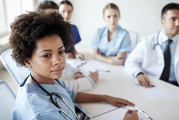 Image showing female doctor over group of medics at hospital