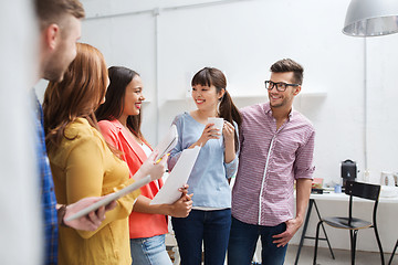 Image showing creative team on coffee break talking at office