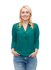 Image showing smiling young woman in shirt and jeans