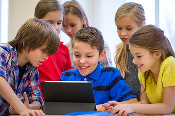 Image showing group of school kids with tablet pc in classroom