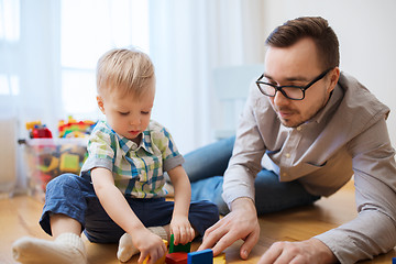 Image showing father and son playing with toy blocks at home