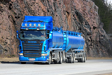 Image showing Blue Scania Tank Truck with Rock Face Background