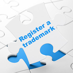 Image showing Law concept: Register A Trademark on puzzle background