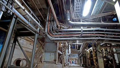 Image showing Equipment, cables and piping as found inside of a modern industr