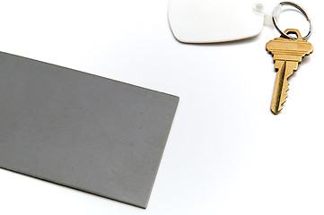 Image showing grey card with key over white