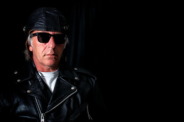 Image showing old school biker on black