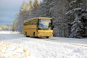 Image showing Yellow Bus on Winter Road