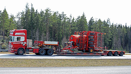 Image showing Scania Semi Hauls Agricultural Machinery in High Speed