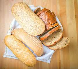 Image showing Freshly baked bread with homespun fabric 