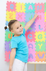 Image showing Little girl is pointing at letter N
