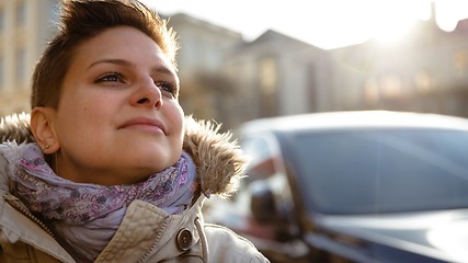 Image showing Young woman looking towards sun