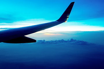 Image showing aircraft wing on blue sky