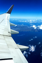 Image showing aircraft wing on blue sky