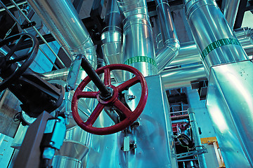 Image showing Equipment, cables and piping as found inside of a modern industr