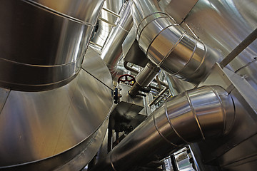 Image showing Equipment, cables and piping as found inside of a modern industr