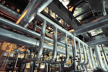 Image showing Equipment, cables and piping as found inside of a modern industr