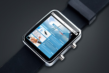 Image showing close up of smart watch with web news on screen