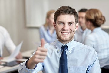 Image showing group of smiling businesspeople meeting in office