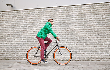 Image showing young hipster man riding fixed gear bike