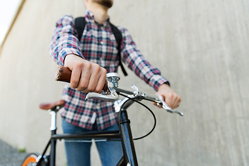 Image showing hipster man with fixed gear bike and backpack