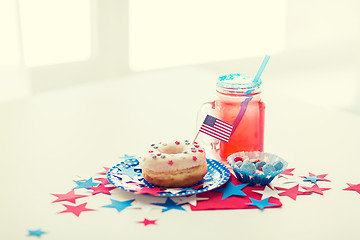 Image showing donut with juice and candies on independence day