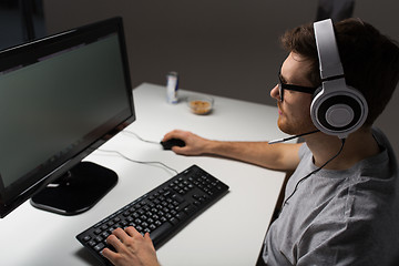 Image showing close up of man playing computer video game