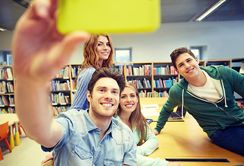 Image showing students with smartphone taking selfie in library