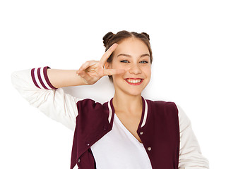 Image showing happy smiling teenage girl showing peace sign