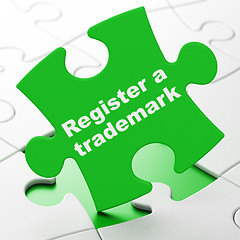 Image showing Law concept: Register A Trademark on puzzle background