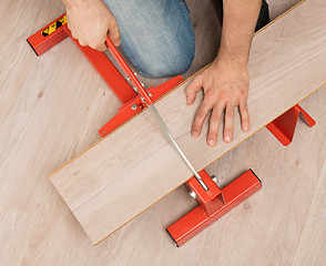 Image showing Red tool for cutting laminate