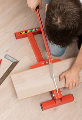 Image showing Red tool for cutting laminate