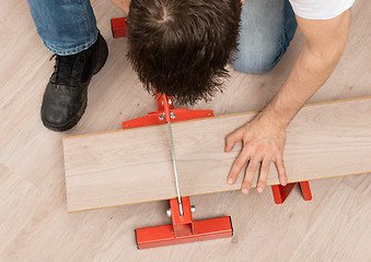 Image showing Red tool for cutting laminate