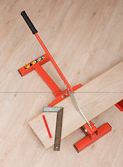 Image showing Red tool for cutting laminate