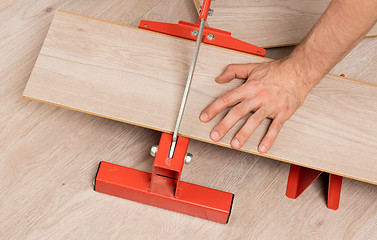 Image showing Red tool for cutting laminate