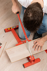 Image showing Red tool for cutting laminate