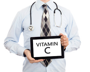 Image showing Doctor holding tablet - Vitamin C