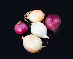 Image showing some onions on a black background