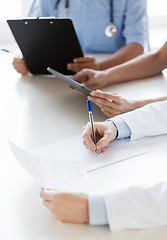 Image showing close up of happy doctors at seminar or hospital