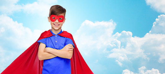 Image showing boy in red super hero cape and mask