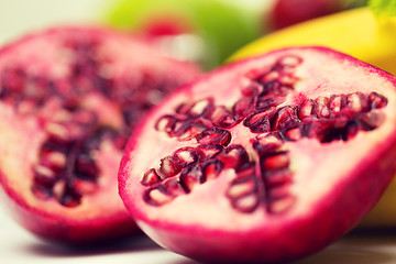 Image showing close up of ripe pomegranate and other fruits